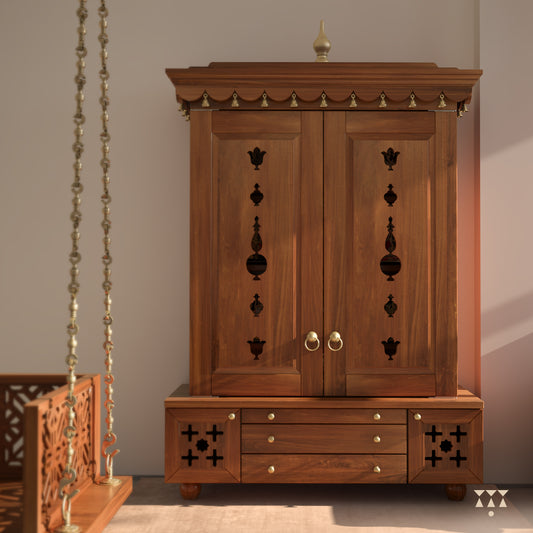 A solid wood mandir with doors, pure brass bells, accessories, cutwork designs and storage, tinted in an almond brown color