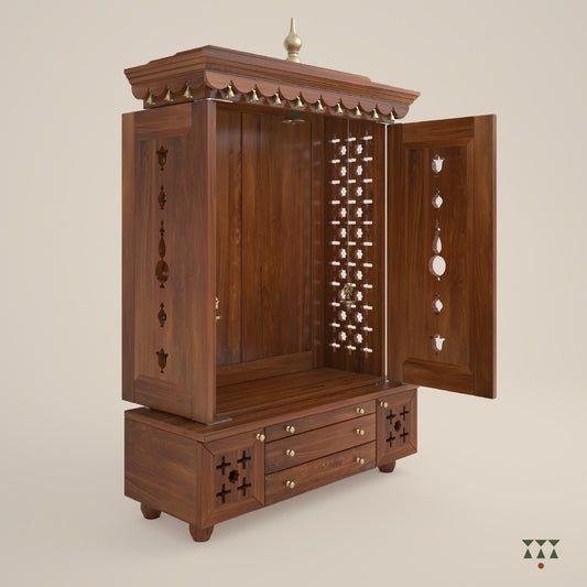 A solid wood mandir with doors, pure brass bells, accessories, cutwork designs and storage, tinted in an almond brown color