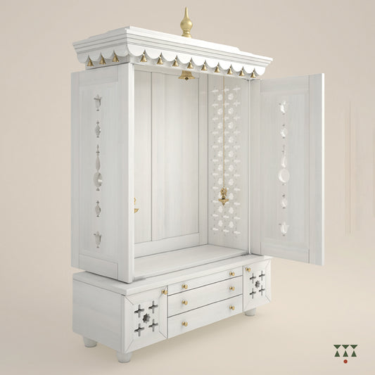 A solid wood mandir with doors, pure brass bells, accessories, cutwork designs and storage, tinted in a snow-white color