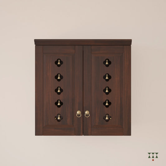A solid wood mandir with pure brass bells, accessories, cutwork designs and storage tinted in tamarind brown