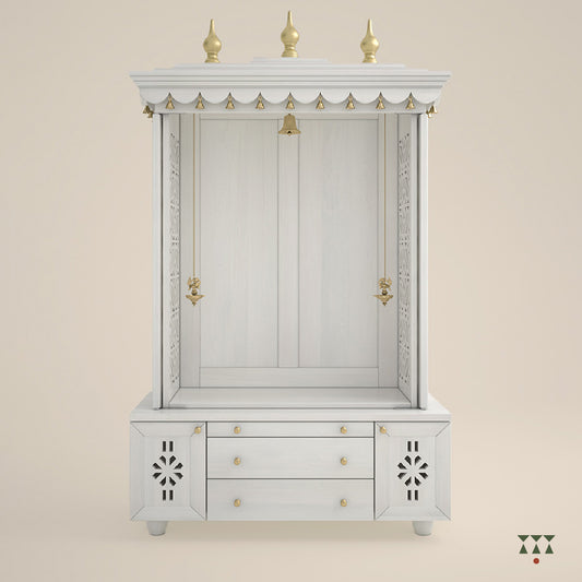 A solid wood mandir with doors, pure brass bells, accessories, cutwork designs and storage, tinted in a snow-white color