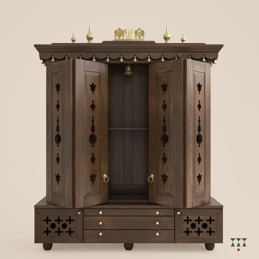 A solid wood mandir with doors, pure brass bells, accessories, cutwork designs and storage, tinted in a mocha brown color