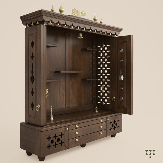 A solid wood mandir with doors, pure brass bells, accessories, cutwork designs and storage, tinted in a mocha brown color