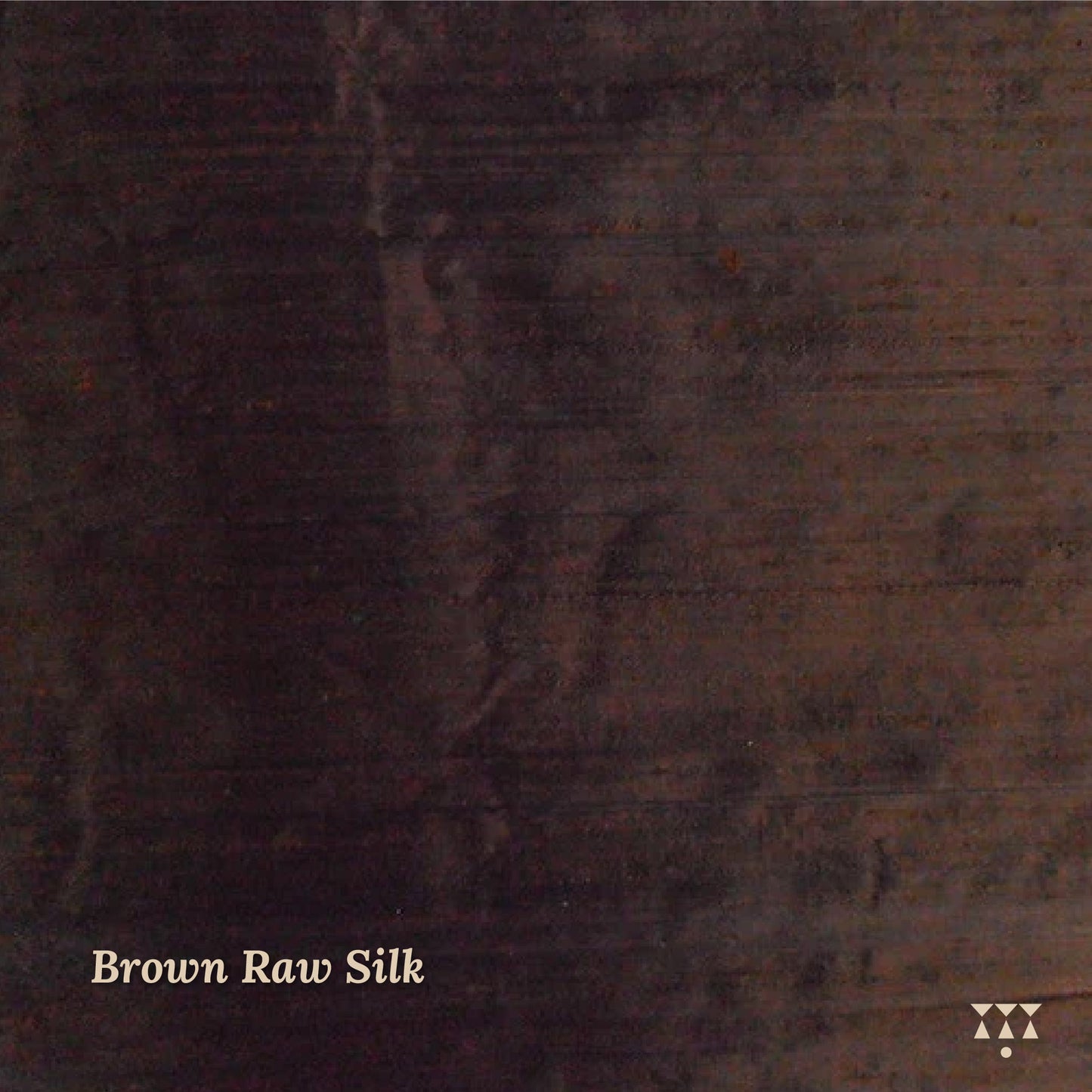 Close up of the brown raw silk upholstery fabric option for the wing chair