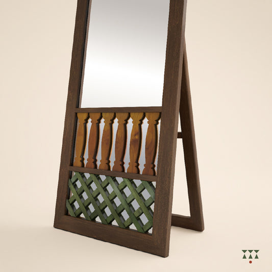 Close up of the trellis pattern at the bottom of a full-length wooden mirror stand, tinted in Brown, Yellow & Green