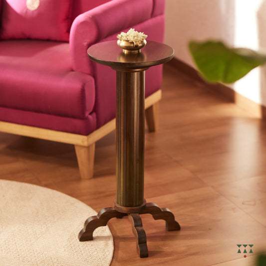 A slender, solid wood side table with a round top and scalloped legs tinted in Mocha Brown with a Moringa Green accent