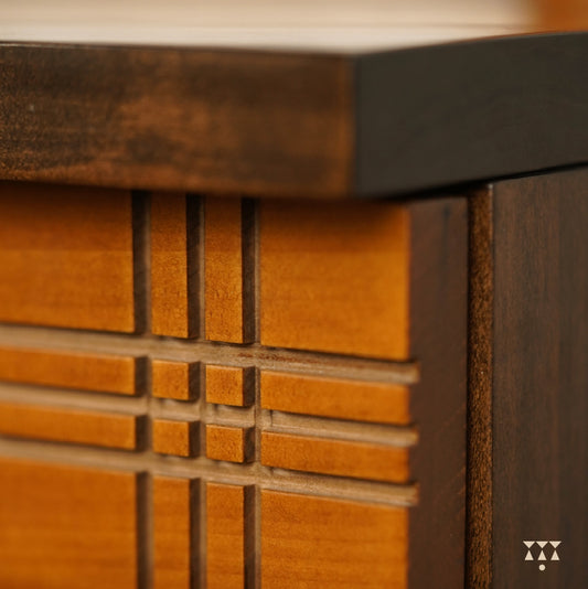 Close up of the facade of a chest of drawers textured with Madras checks patterns, tinted in Mocha Brown & Mustard Yellow