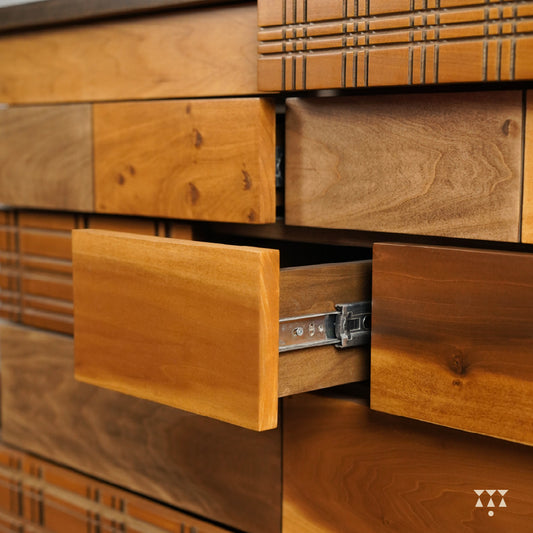 Close up of the facade of a chest of drawers textured with Madras checks patterns, tinted in Mocha Brown & Mustard Yellow