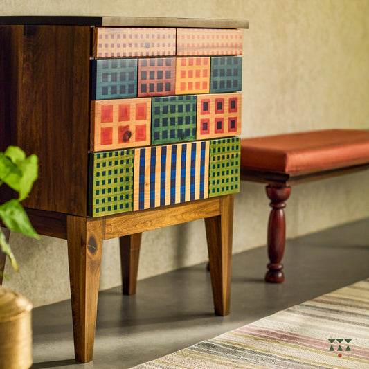 A petite chest of drawers with vibrant facade inspired by the color blocks of Madras check textiles, crafted in solid wood