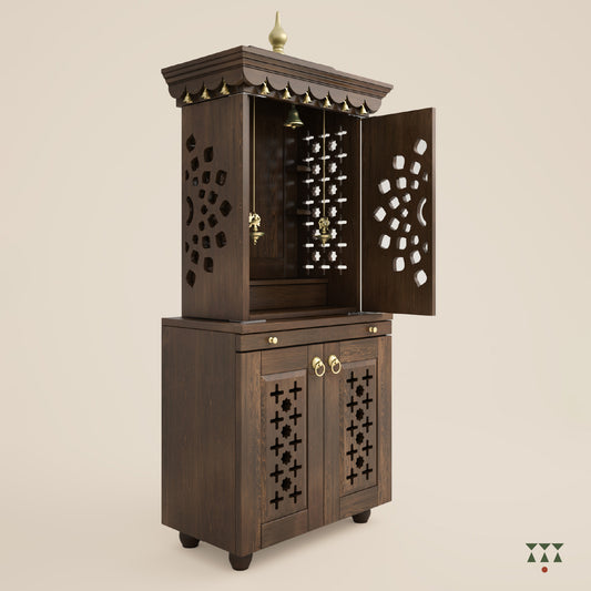 A tall wooden mandir with doors, pure brass elements, cutwork designs and storage, tinted in mocha brown