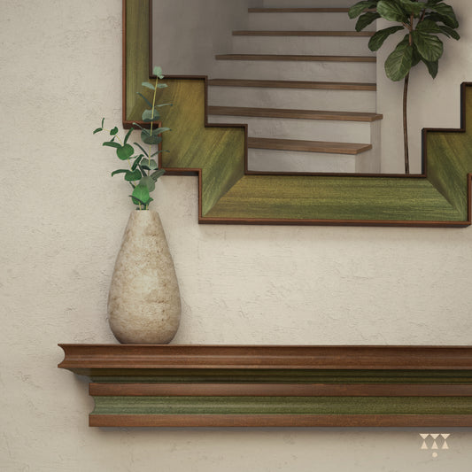 Close up of the step patterned bottom edges of a large wooden mirror tinted in Mustard Yellow, Moringa Green & Mocha Brown