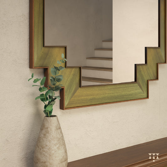 Close up of the step patterned bottom edges of a large wooden mirror tinted in Mustard Yellow, Moringa Green & Mocha Brown