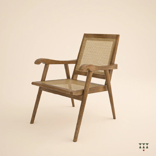Solid wood armchair with a woven back and seat tinted in desert brown with a green silk embroidered cushion