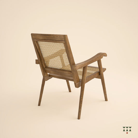 Solid wood armchair with a woven back and seat tinted in desert brown with a green silk embroidered cushion