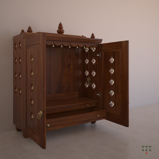 A solid wood mandir with doors, pure brass bells, accessories, cutwork designs and storage, tinted in almond brown