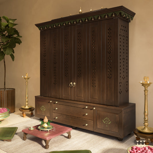 Wooden pooja cabinet with decorative elements in a room setting