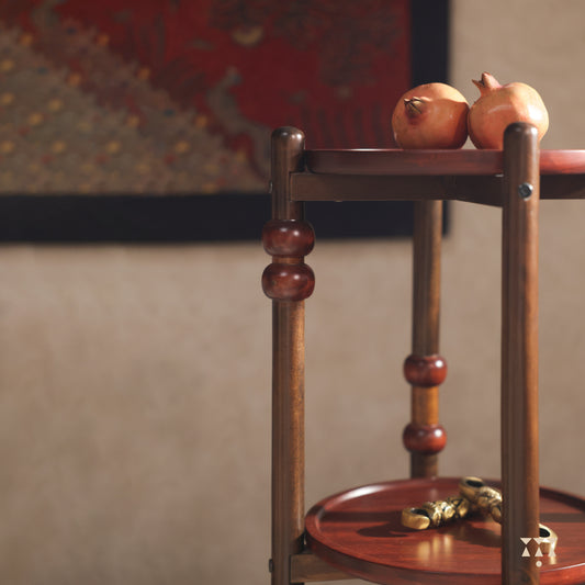A circular, layered solid wood end table with turned legs, tinted in Mocha Brown with Saffron Orange & Mustard Yellow accents