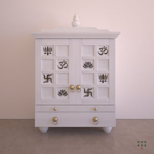 A solid wood mandir with doors, pure brass bells, cutwork designs and storage, tinted in snow white