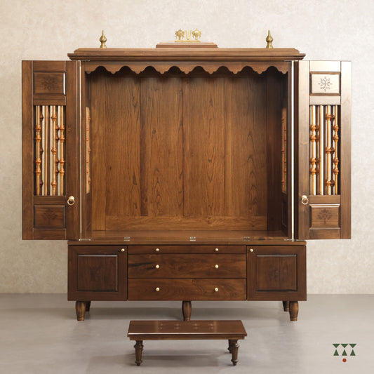 Pooja room set focusing on a solid wood mandir with doors, etched designs, pure brass elements and storage with a platform