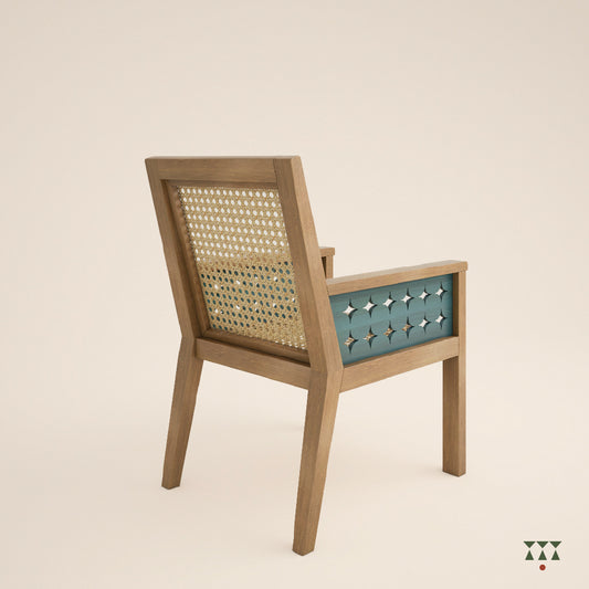 Solid wood armchair with a woven back and seat, and the body tinted in sand brown with the cutwork armrest in a lagoon blue