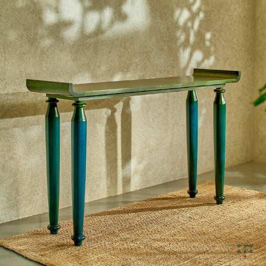 Sculptural console with curved edges and turned legs handcrafted in solid wood, tinted in Lagoon Blue & Moringa Green