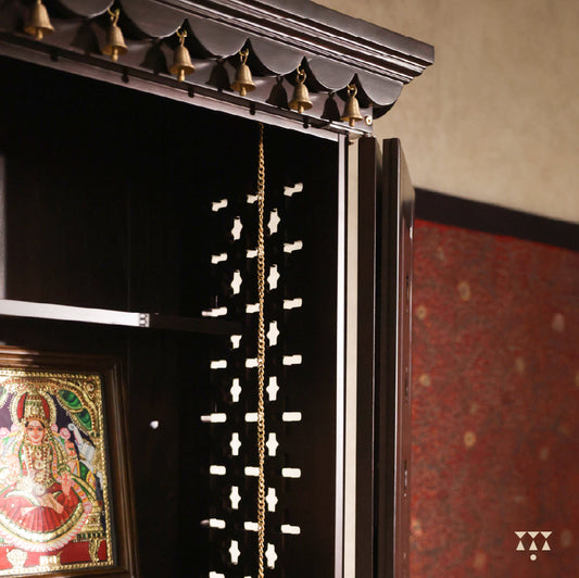 Close up of Vignaharta Wooden temple showing framed artwork and decorative elements