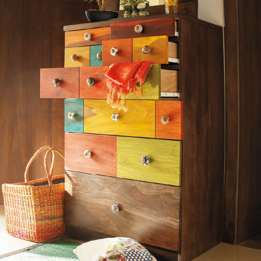 A colorful chest of drawers for storage styles with a basket.