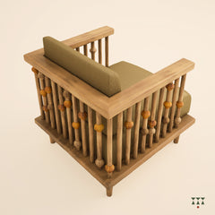 A close up of multiple turned spindles that make the armrest of a solid wood statement armchair