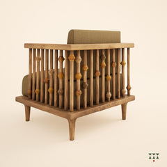 Multiple turned spindles make up the armrest of a solid wood statement armchair