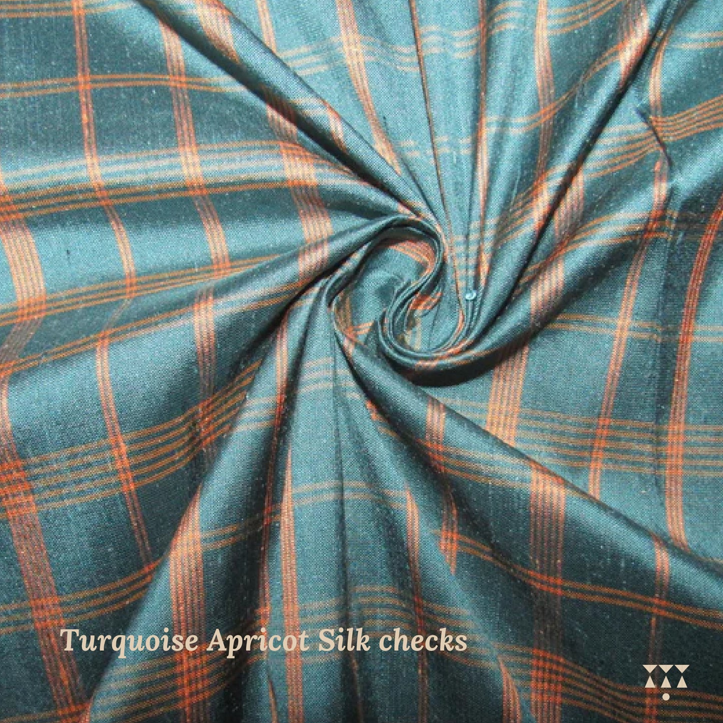 Turquoise and apricot checkered fabric with a swirl pattern
