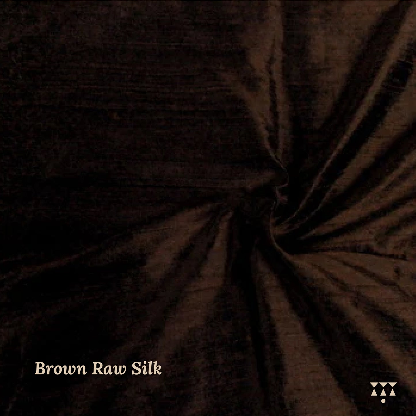 Close up of the brown raw silk upholstery fabric for the wing chair.