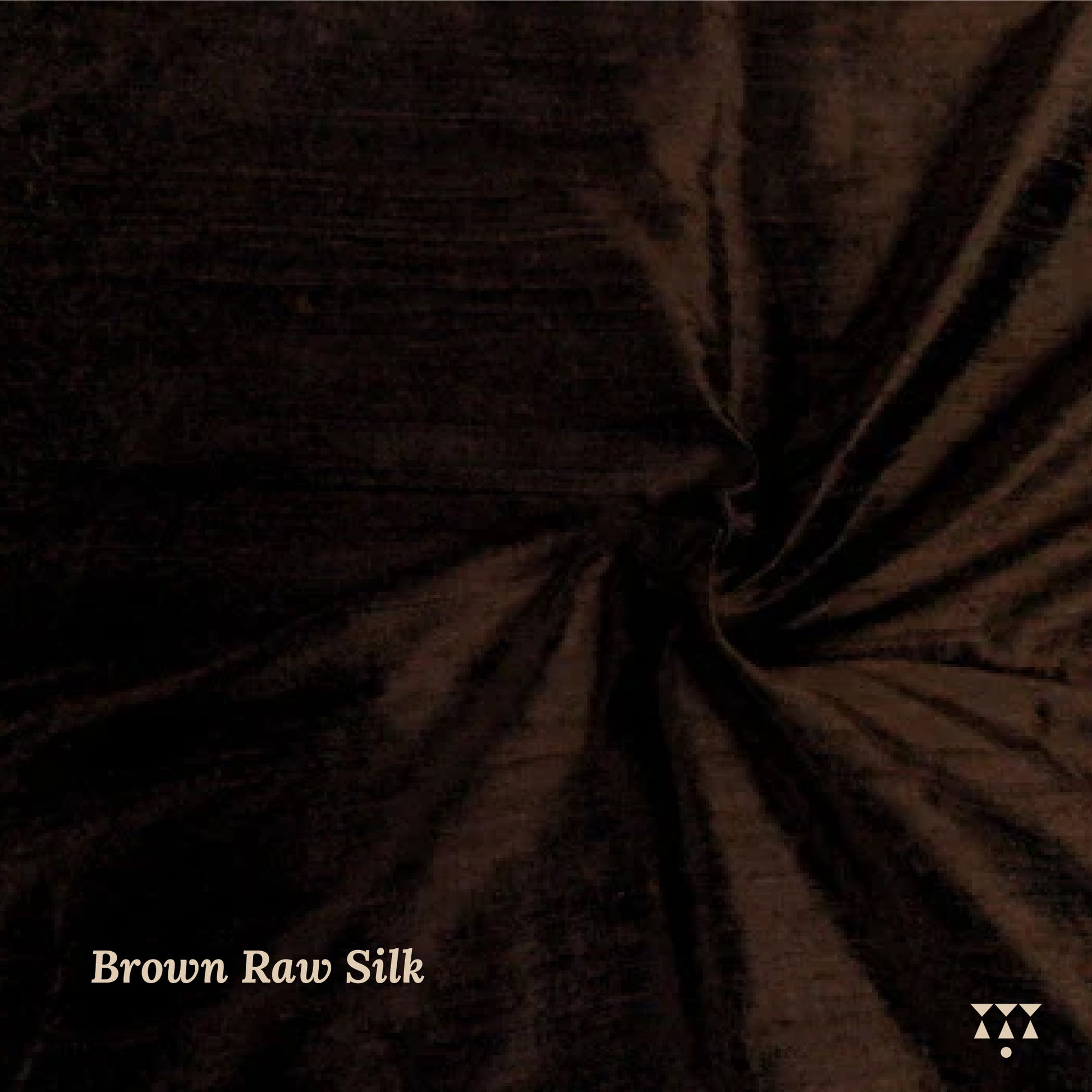 Close up of the brown raw silk upholstery fabric for the wing chair.