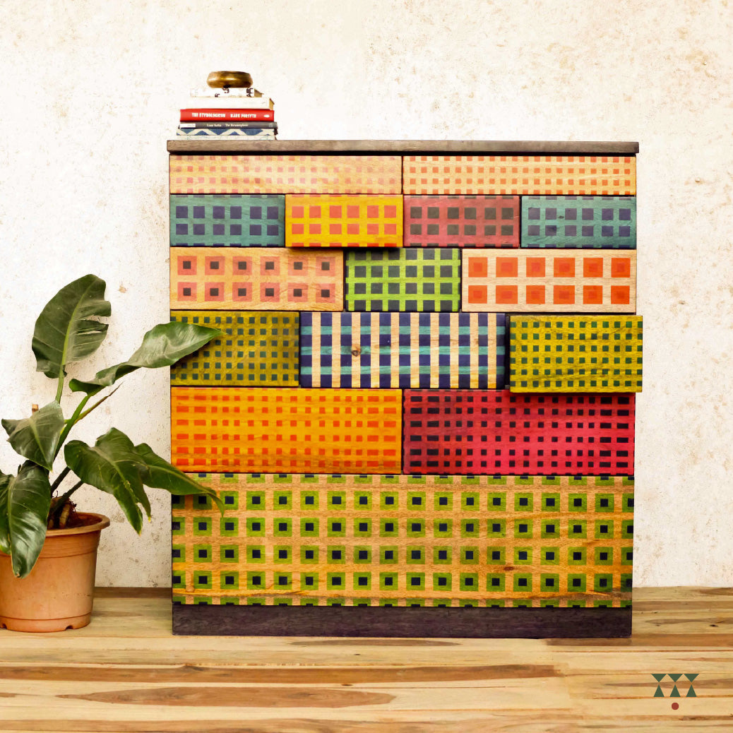 A wooden chest with patterns inspired from madras checks.