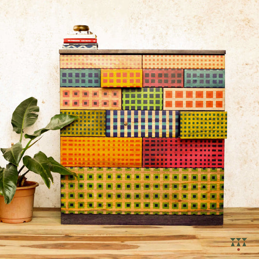 A wooden chest with patterns inspired from madras checks.