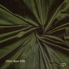 Close up of the olive-green raw silk upholstery fabric option for the wing chair 