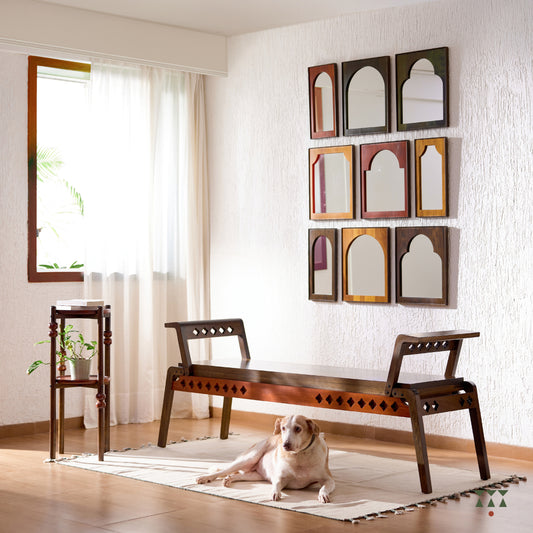 Lifestyle image of layered wooden table with turned legs, tined in Mocha Brown with Saffron Orange & Mustard Yellow accents