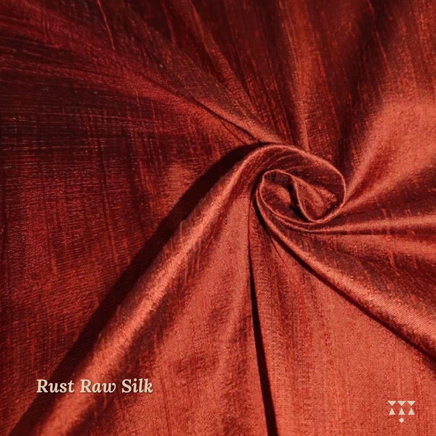 Close up of the rust raw silk upholstery fabric option for the wing chair 