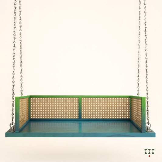 A wooden swing with weaving, tinted in Aqua Blue & Leaf Green with decorative brass chains