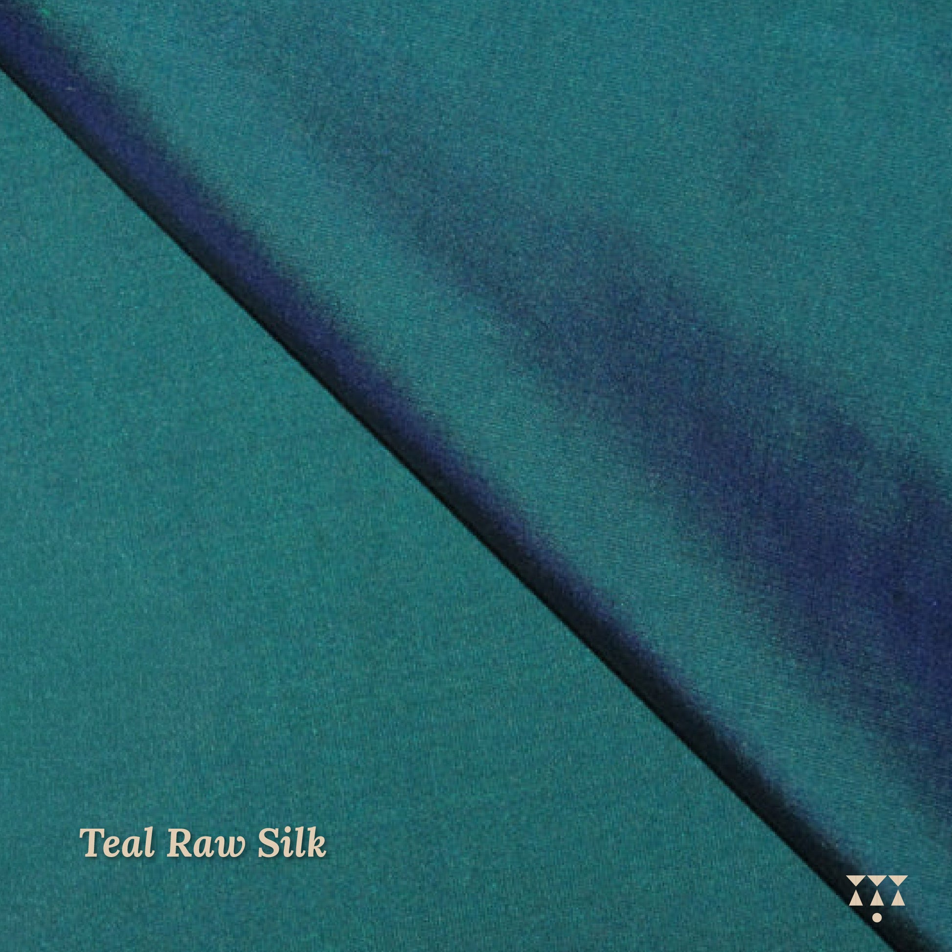 Close up of the teal-blue raw silk upholstery fabric option for the wing chair 