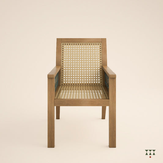 Solid wood armchair with a woven back and seat, and the body tinted in sand brown with the cutwork armrest in a lagoon blue