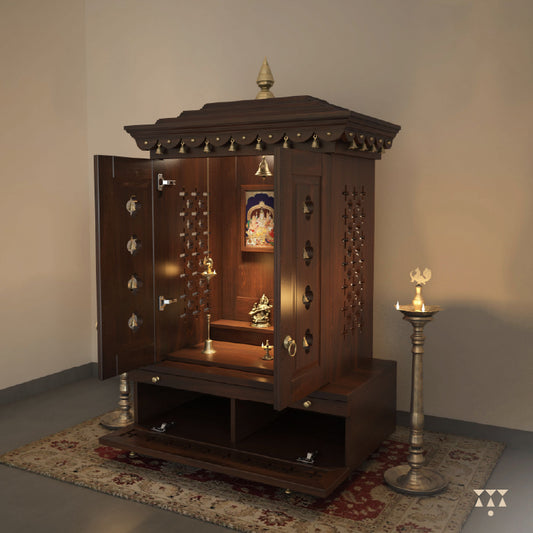 A wooden mandir with doors, pure brass elements, framed art prints, cutwork designs and storage, tinted in tamarind brown