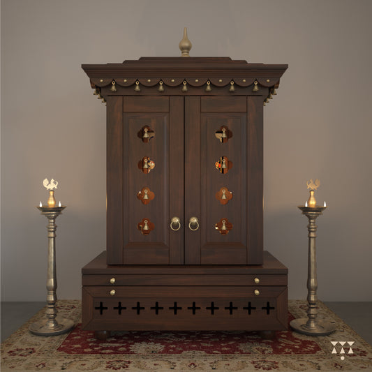 A wooden mandir with doors, pure brass elements, cutwork designs and storage, tinted in tamarind brown