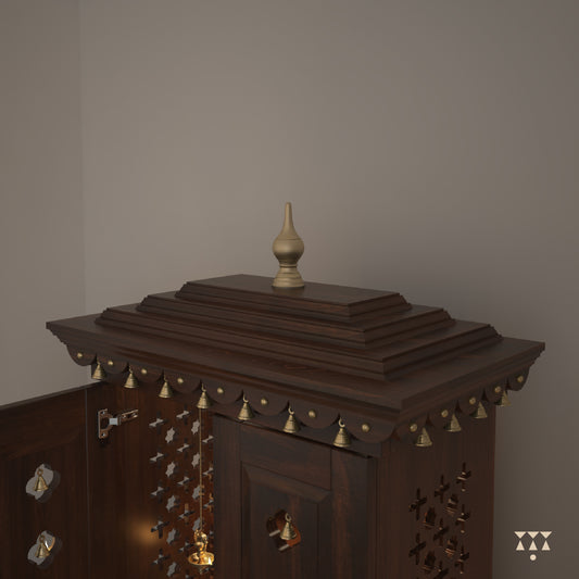 Close up of a wooden mandir with doors, pure brass elements, cutwork designs and storage, tinted in tamarind brown