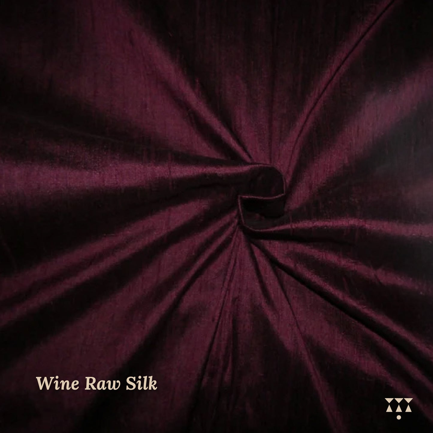 Close up of the wine raw silk upholstery fabric option for the wing chair 