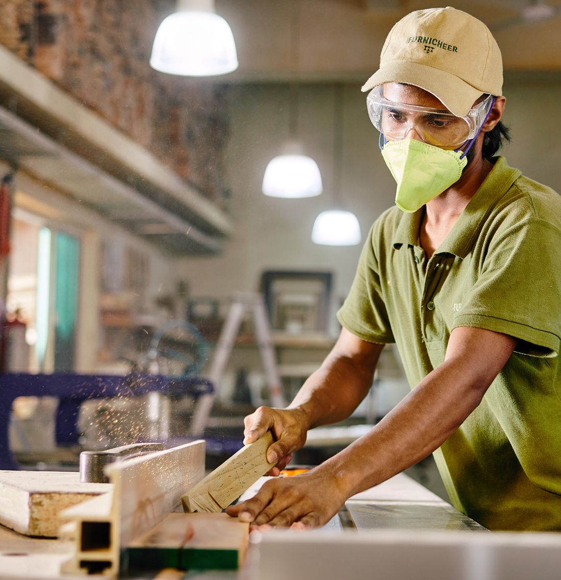 Furnicheer artisan shaping solid wood on a woodworking machine to create handcrafted wooden furniture.