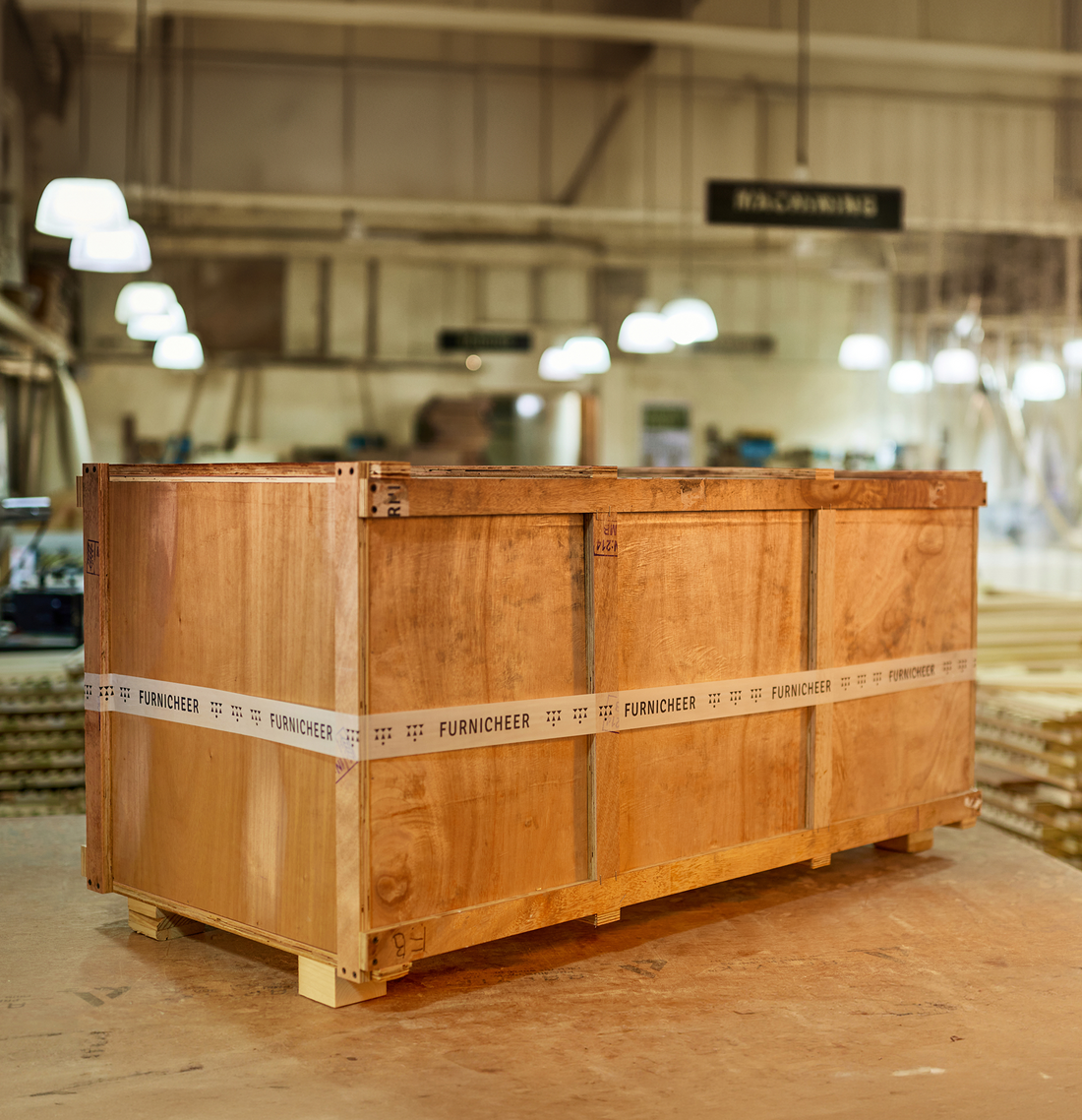 Sturdy wooden shipping crate secured with Furnicheer branded tape for protective furniture packaging.